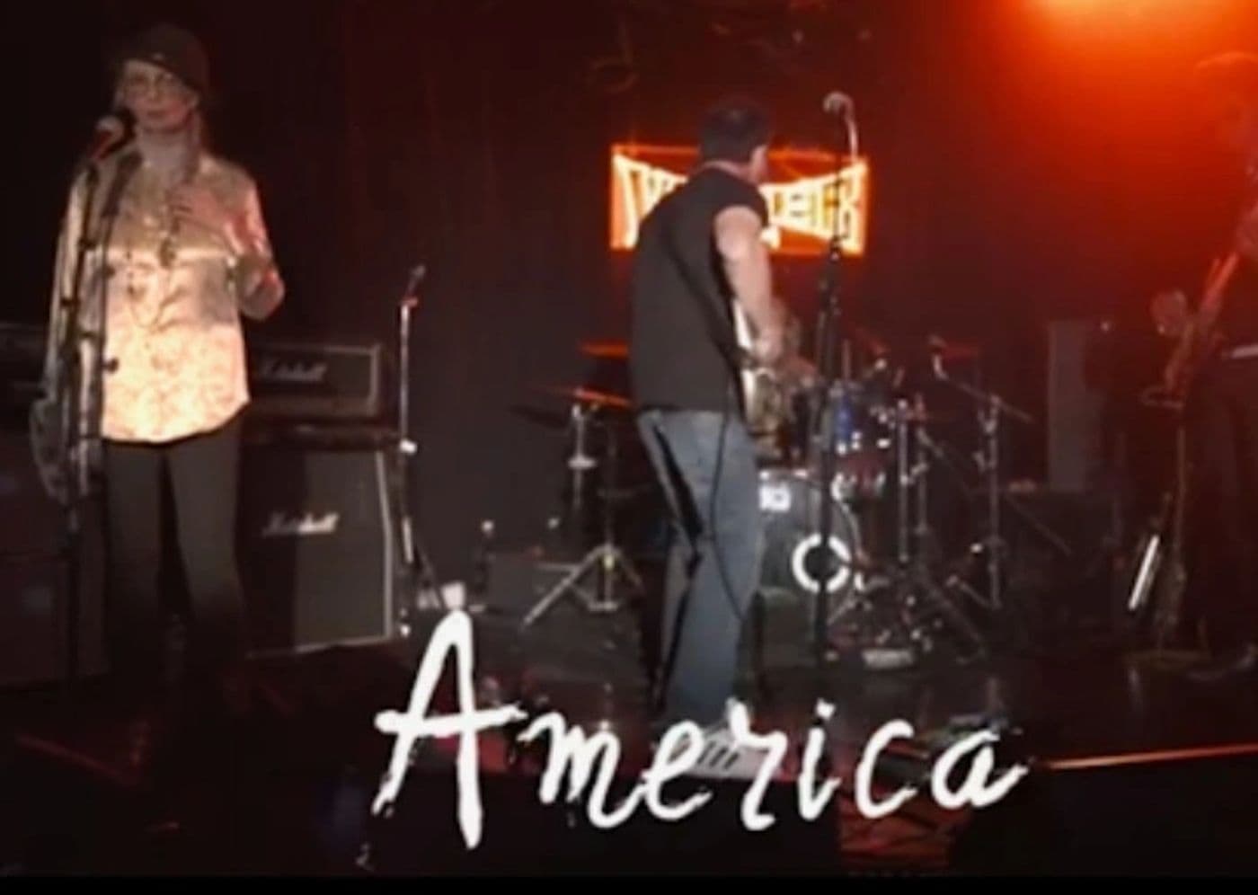Live still from America, the band performing at the Viper Room