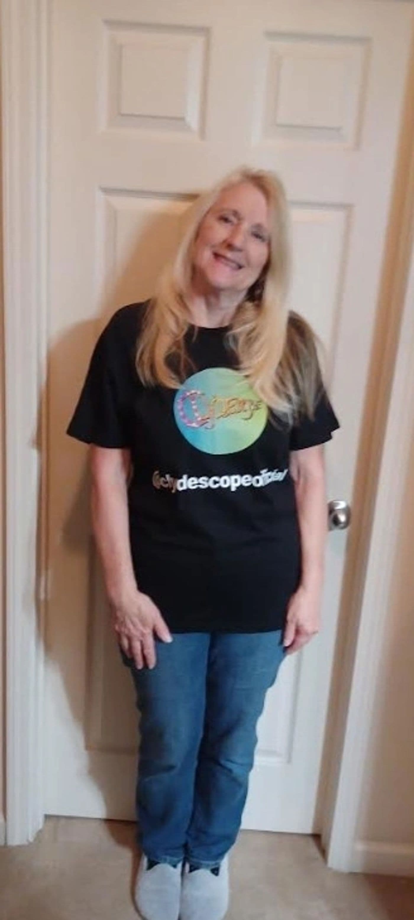 A fan wearing the black Clydescope official t-shirt